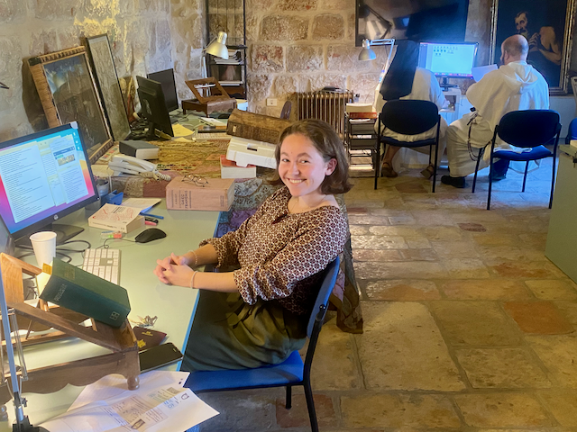 Anne-Laure at her post (in the background, Fr. Jorge Vargas at work with Sr Marie Reine)